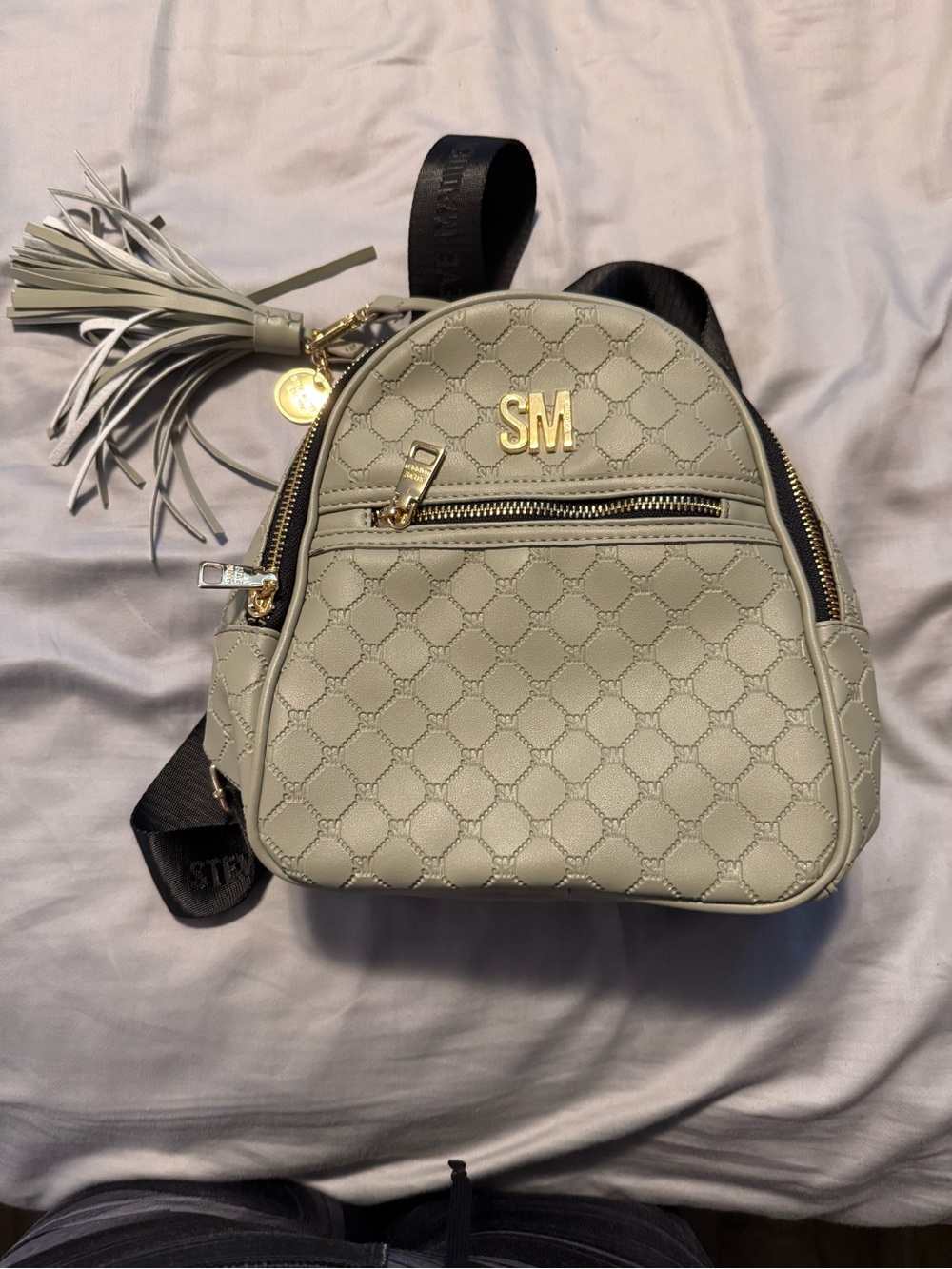 Steve Madden Cream Quilted Mini Backpack with Tassel